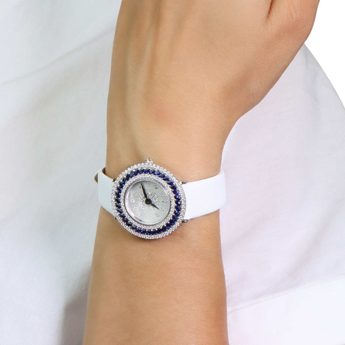 White gold watch with diamonds and blue sapphires